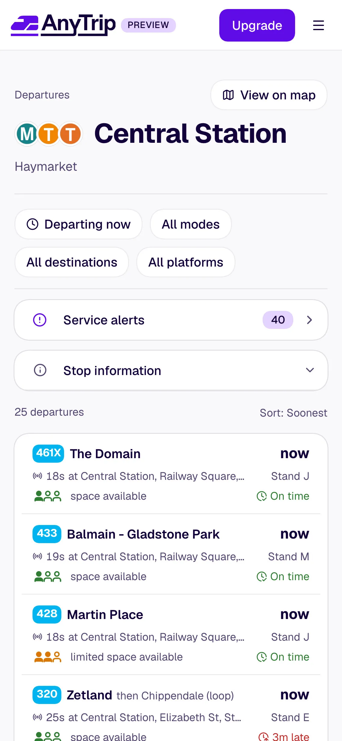 AnyTrip’s mobile departures view for Central Station, Haymarket, with filters for departure time, modes, destinations and platforms, service alerts, and a list of bus departures to The Domain, Balmain – Gladstone Park, Martin Place and Zetland showing stands, live status and how full each service is.