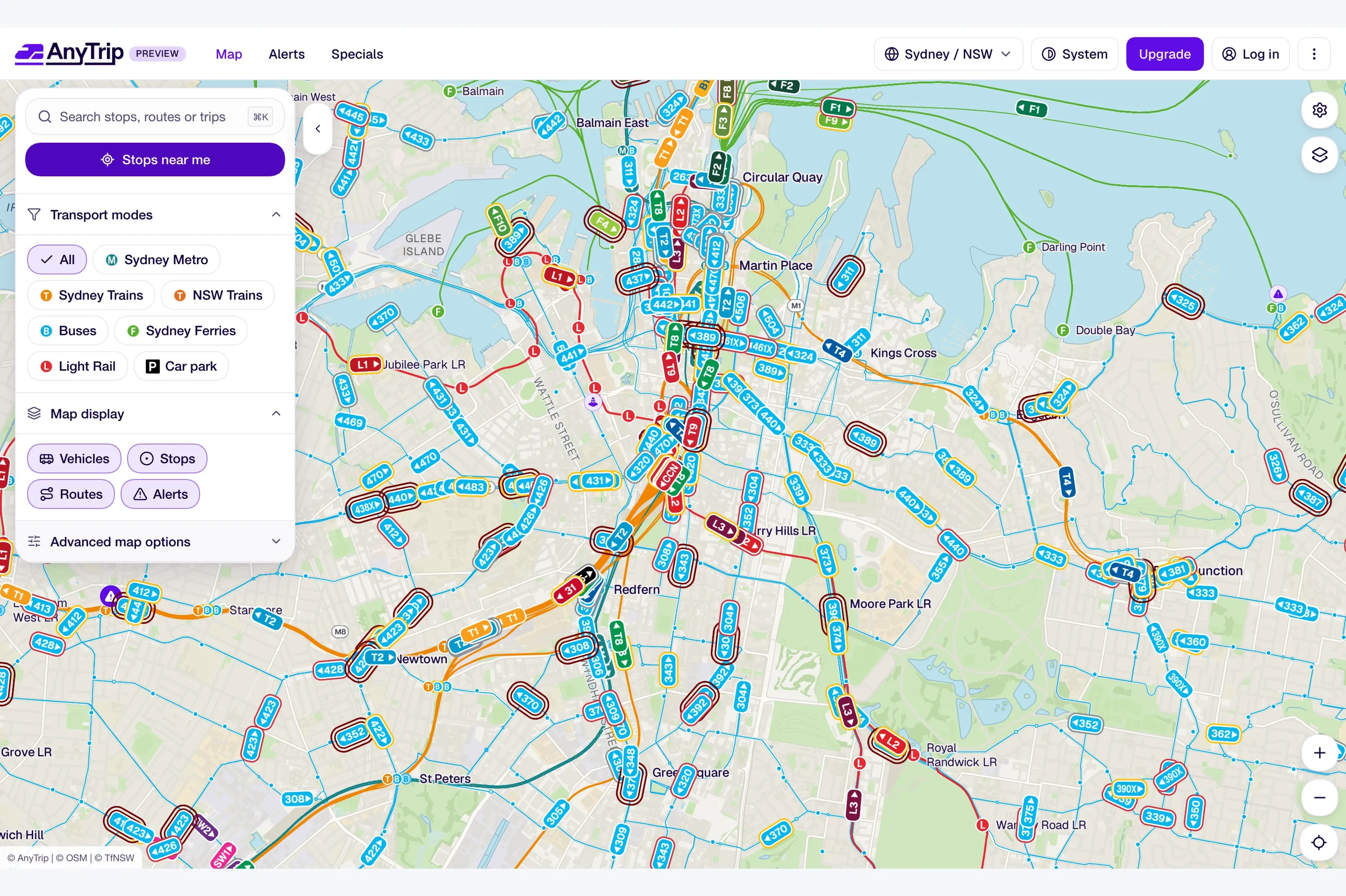 The AnyTrip live service map of Sydney, showing vehicles on train, bus, ferry and light rail routes, with transport mode filters in a side panel.